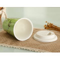 18oz Porcelain Travel Mug with White Sleeve Lid.